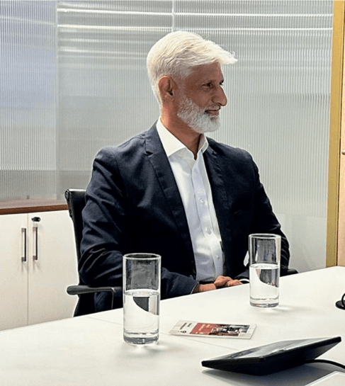Professor Tas Qureshi seated at the table during the FabStuff Podcast recording.