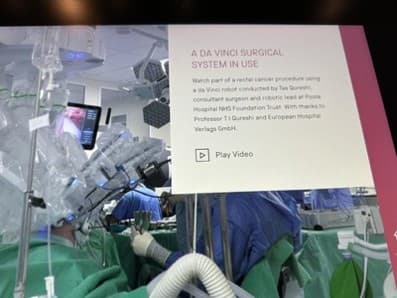 Touchscreen display in the Science Museum showing footage of a da Vinci robotic surgical procedure.