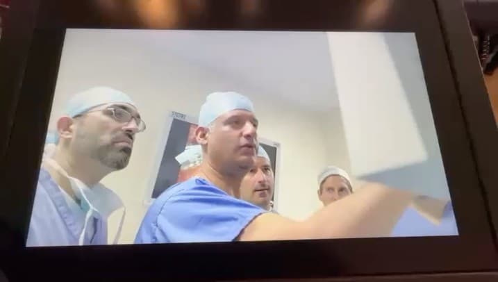 Operating theatre footage of Professor Qureshi's surgical team shown on the Science Museum touchscreen.