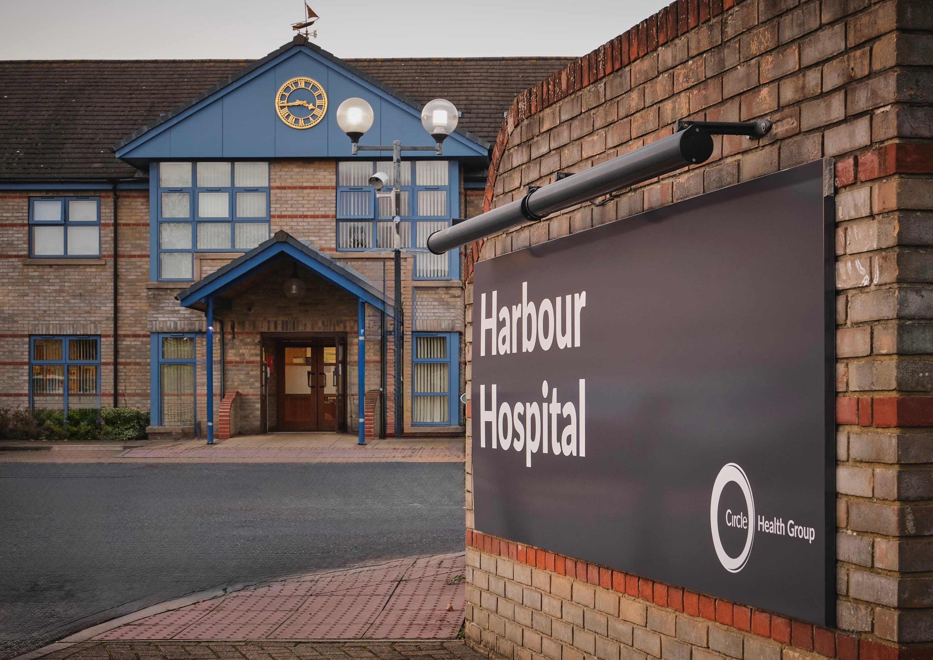Exterior view of The Harbour Hospital entrance and sign in Poole.