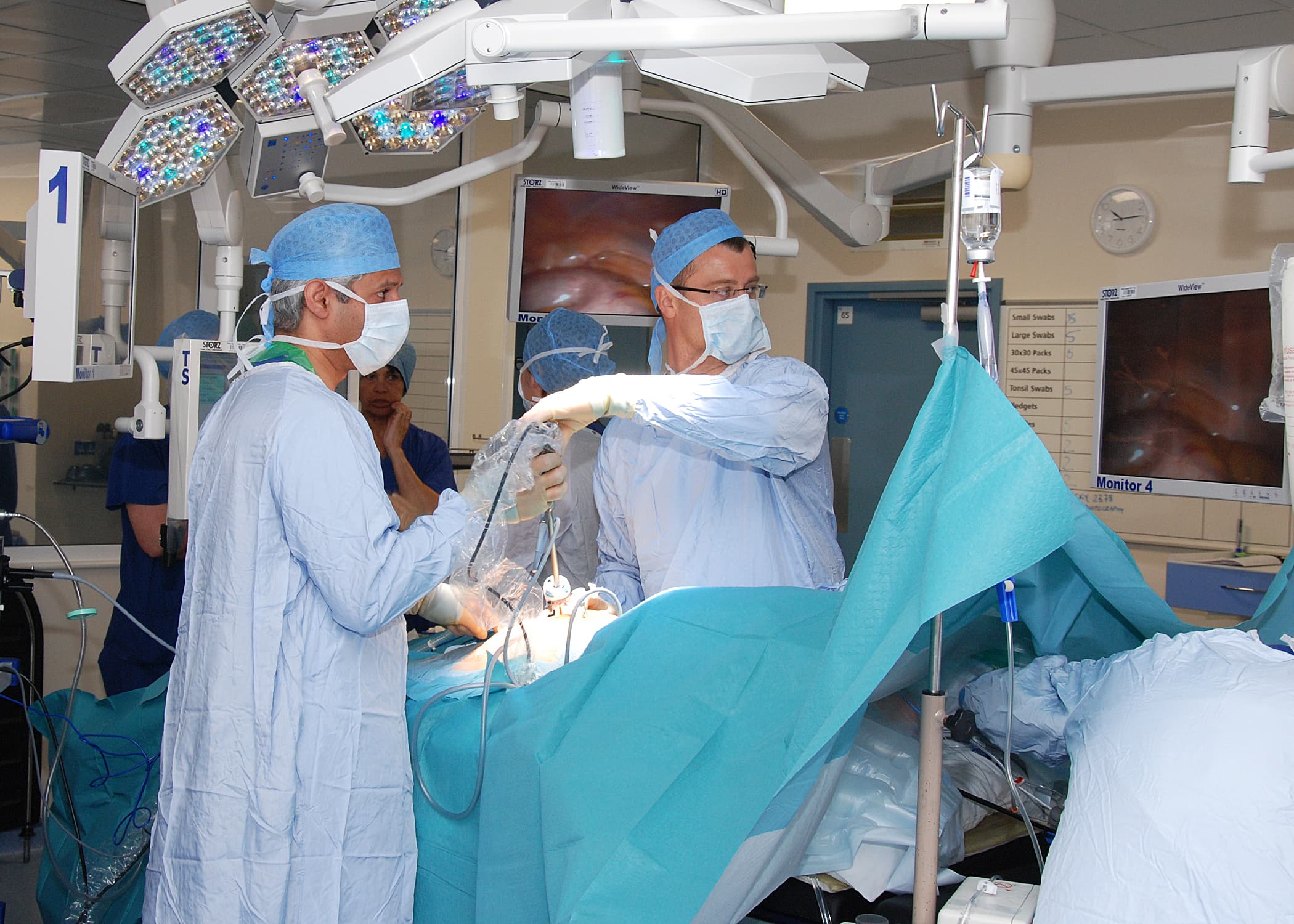 Robotic surgery console and theatre environment.